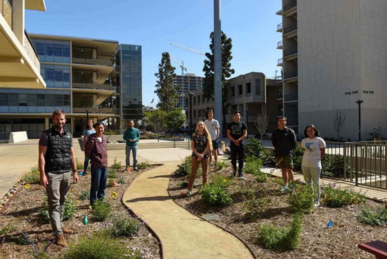 Students walking through butterfly garden