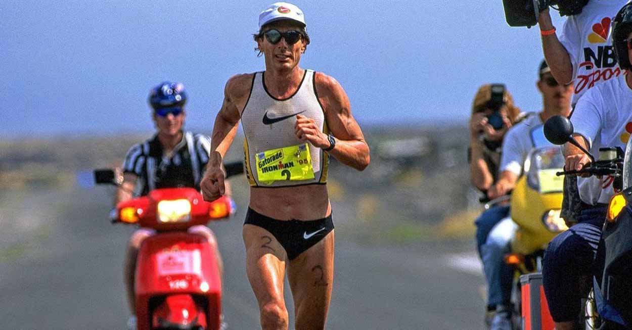 Man running on beach along motorists poster
