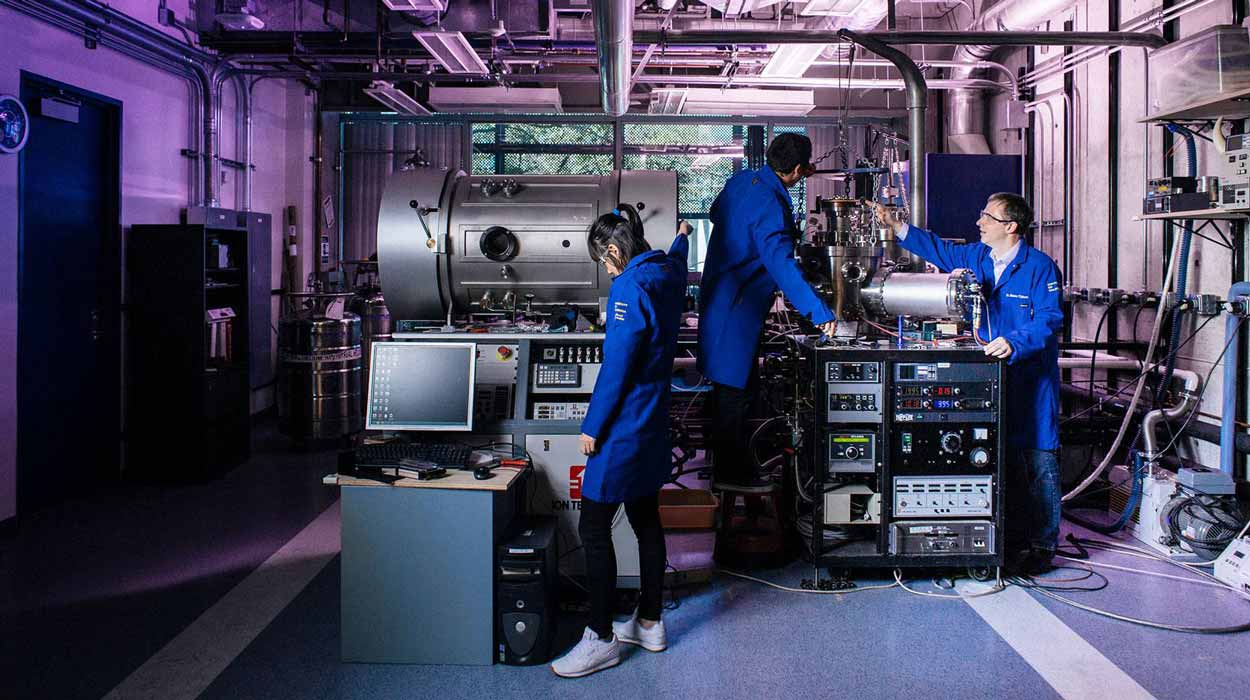 Scientists working in lab with advanced equipment